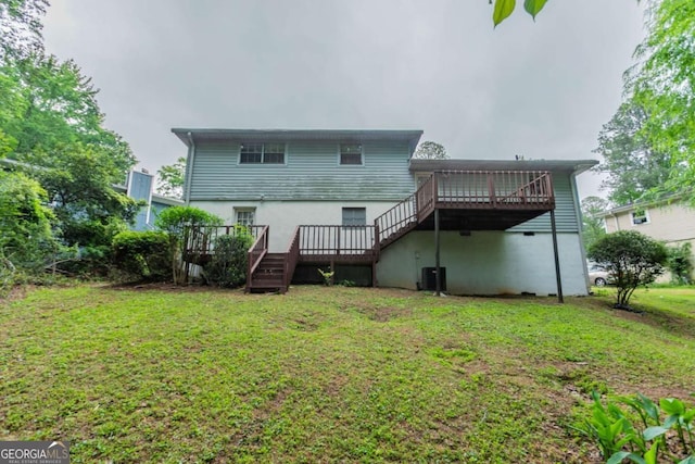 3664 Satellite Ter, Ellenwood, GA 30294 - back of house with a lawn, stucco siding, a wooden deck, and central AC