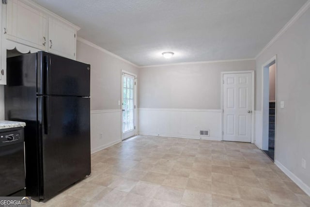 3664 Satellite Ter, Ellenwood, GA 30294 - kitchen with black appliances, ornamental molding, light countertops, and white cabinets