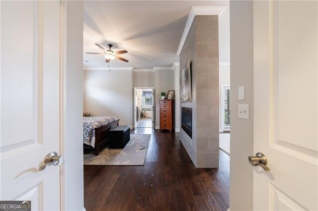 860 Hargrove Point Way, Alpharetta, GA 30004 - bedroom with ornamental molding, multiple windows, dark wood-style flooring, and a fireplace