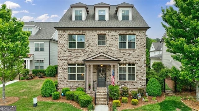 860 Hargrove Point Way, Alpharetta, GA 30004 - view of front of house featuring fence, a front yard, and brick siding