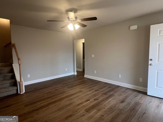 68 Davis Lake Rd Lot 16, Thomaston, GA 30286 - unfurnished living room with dark wood-type flooring, ceiling fan, stairway, and baseboards