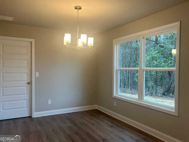 68 Davis Lake Rd Lot 16, Thomaston, GA 30286 - unfurnished dining area featuring an inviting chandelier, dark wood-type flooring, and baseboards