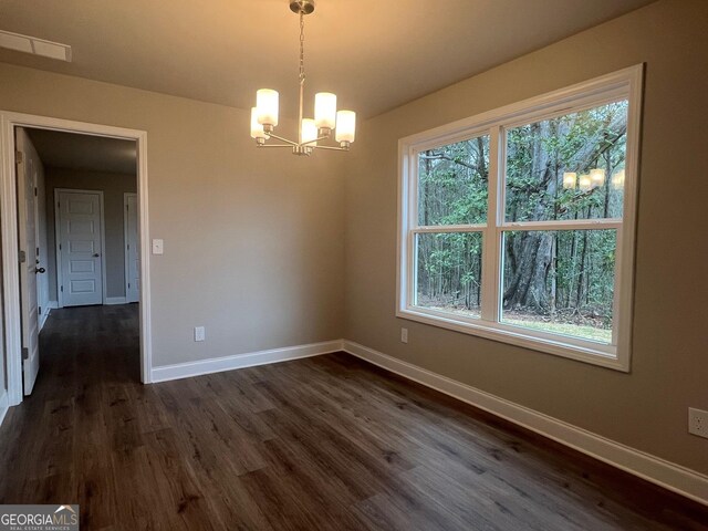 68 Davis Lake Rd Lot 16, Thomaston, GA 30286 - unfurnished dining area featuring visible vents, a notable chandelier, dark wood finished floors, and baseboards