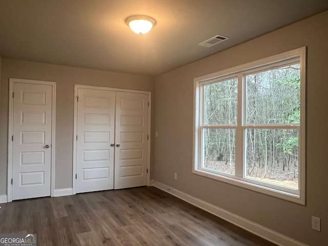 68 Davis Lake Rd Lot 16, Thomaston, GA 30286 - unfurnished bedroom featuring visible vents, a closet, dark wood finished floors, and baseboards