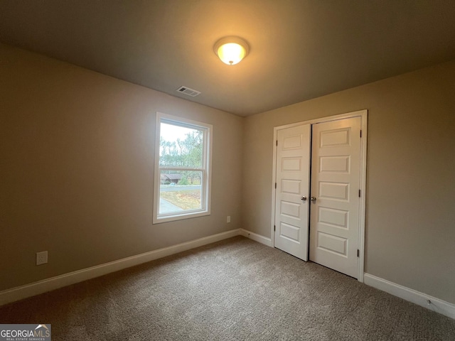 68 Davis Lake Rd Lot 16, Thomaston, GA 30286 - unfurnished bedroom with a closet, visible vents, carpet, and baseboards