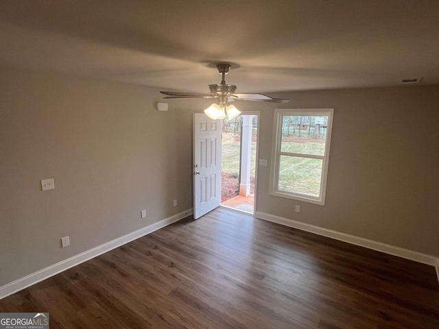 68 Davis Lake Rd Lot 16, Thomaston, GA 30286 - spare room featuring dark wood-style flooring, visible vents, a ceiling fan, and baseboards