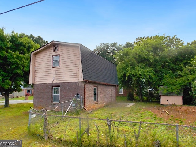 10 Hawk Rd NW, Cartersville, GA 30121 - view of property exterior featuring brick siding, a gambrel roof, and a shingled roof