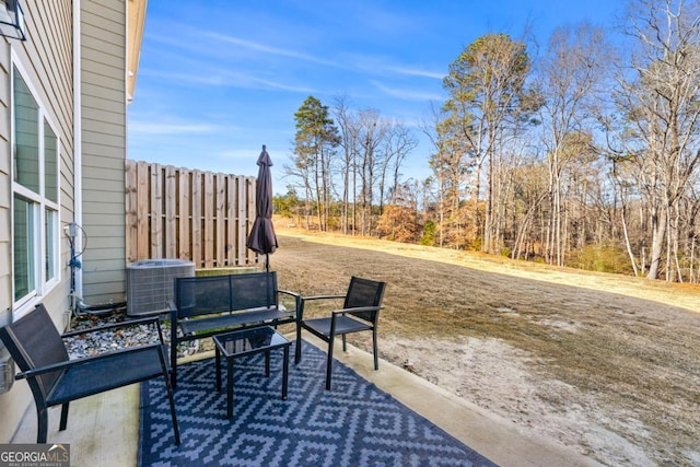 view of patio / terrace with central AC and fence