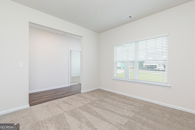 239 Oliver Dr, Locust Grove, GA 30248 - unfurnished room with baseboards, visible vents, and carpet flooring