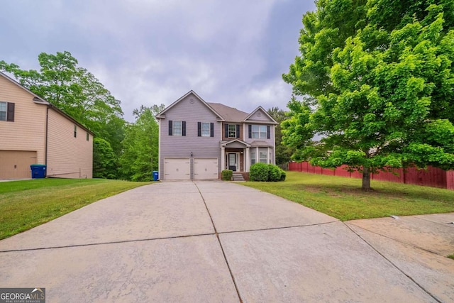 535 Pierpoint Dr, Atlanta, GA 30331 - view of front facade with a front lawn, driveway, fence, and a garage