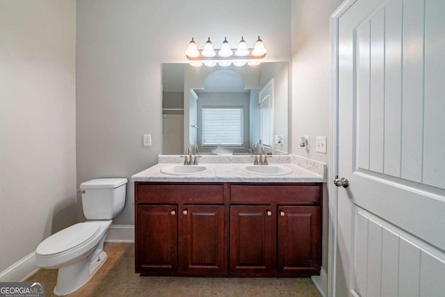535 Pierpoint Dr, Atlanta, GA 30331 - full bathroom featuring a sink, double vanity, toilet, and tile patterned floors