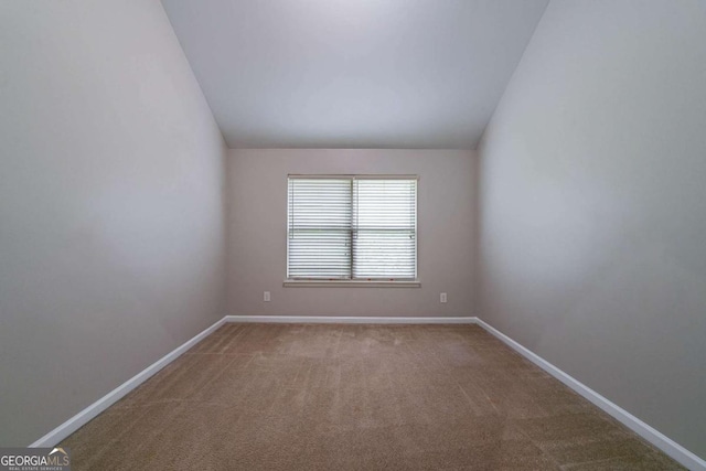 535 Pierpoint Dr, Atlanta, GA 30331 - carpeted empty room with vaulted ceiling and baseboards