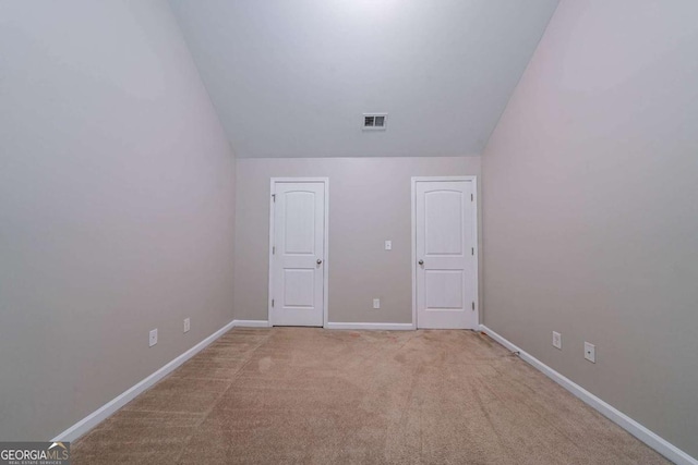 535 Pierpoint Dr, Atlanta, GA 30331 - unfurnished bedroom with lofted ceiling, carpet, baseboards, and visible vents
