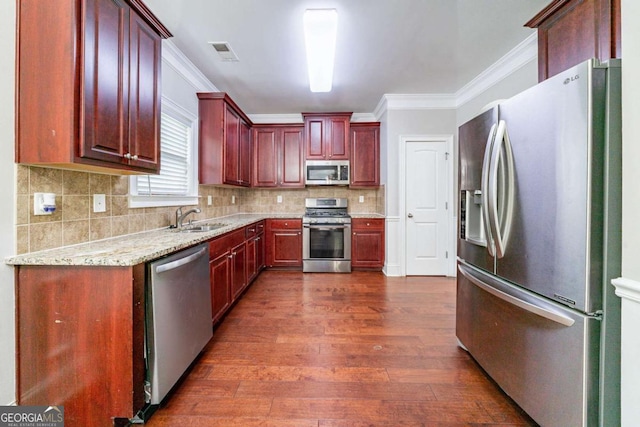 535 Pierpoint Dr, Atlanta, GA 30331 - kitchen with dark wood-style flooring, visible vents, a sink, crown molding, and stainless steel appliances