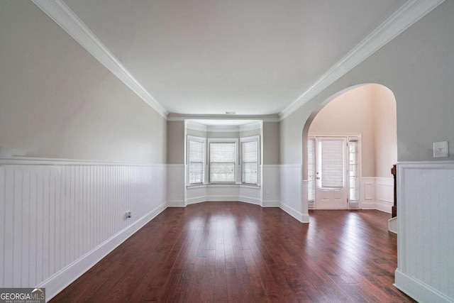 535 Pierpoint Dr, Atlanta, GA 30331 - unfurnished room featuring ornamental molding, wood-type flooring, wainscoting, and arched walkways