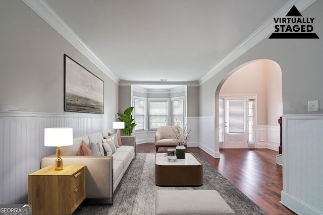 535 Pierpoint Dr, Atlanta, GA 30331 - living room with arched walkways, wainscoting, crown molding, and wood finished floors
