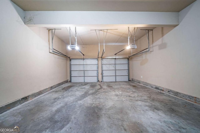 535 Pierpoint Dr, Atlanta, GA 30331 - garage with baseboards and a garage door opener