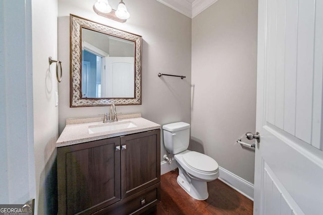 535 Pierpoint Dr, Atlanta, GA 30331 - bathroom with toilet, baseboards, ornamental molding, vanity, and wood finished floors