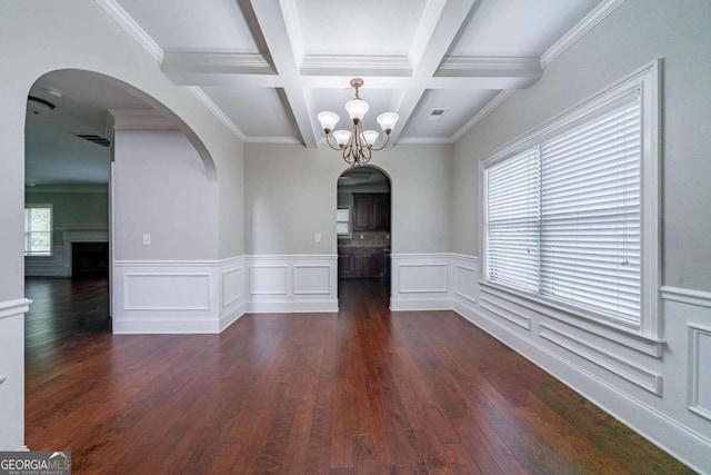 535 Pierpoint Dr, Atlanta, GA 30331 - unfurnished dining area with coffered ceiling, a notable chandelier, dark wood-style flooring, beamed ceiling, and arched walkways