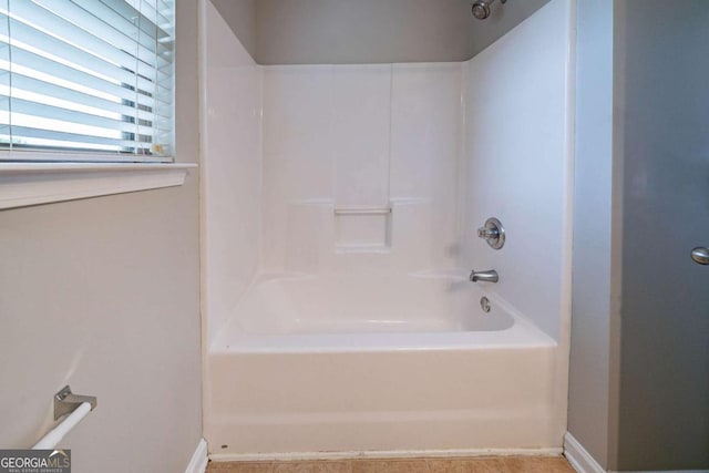 535 Pierpoint Dr, Atlanta, GA 30331 - bathroom with baseboards and shower / tub combination