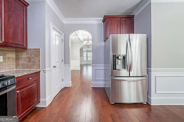 535 Pierpoint Dr, Atlanta, GA 30331 - kitchen with range, reddish brown cabinets, stainless steel fridge, and dark wood-style floors