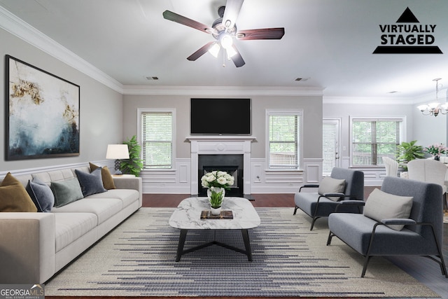 535 Pierpoint Dr, Atlanta, GA 30331 - living area featuring crown molding, ceiling fan with notable chandelier, and wood finished floors