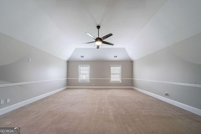 535 Pierpoint Dr, Atlanta, GA 30331 - interior space with light colored carpet, vaulted ceiling, baseboards, and a ceiling fan