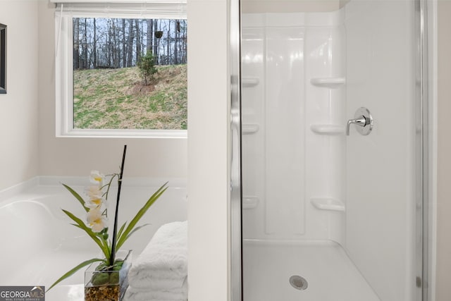 bathroom with a shower stall