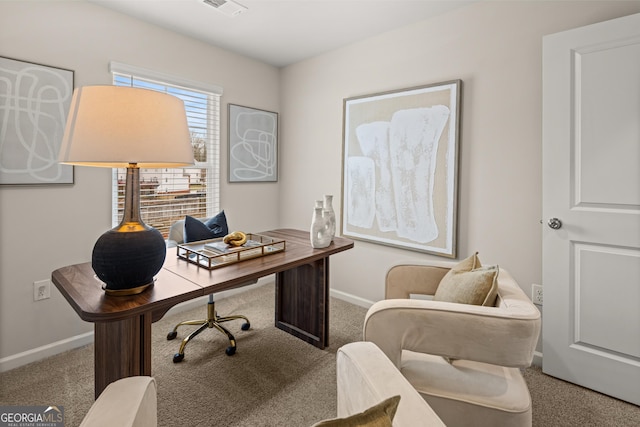 home office with baseboards, visible vents, and carpet