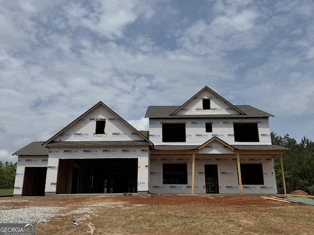 1069 Red Oak Blvd, Loganville, GA 30052 - unfinished property featuring a garage and a shingled roof