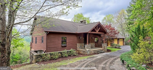 2608 The Rdgs, Hiawassee, GA 30546 - view of front of property featuring a chimney and roof with shingles