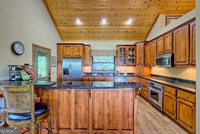 2608 The Rdgs, Hiawassee, GA 30546 - kitchen with appliances with stainless steel finishes, wooden ceiling, a sink, brown cabinetry, and light wood-style flooring