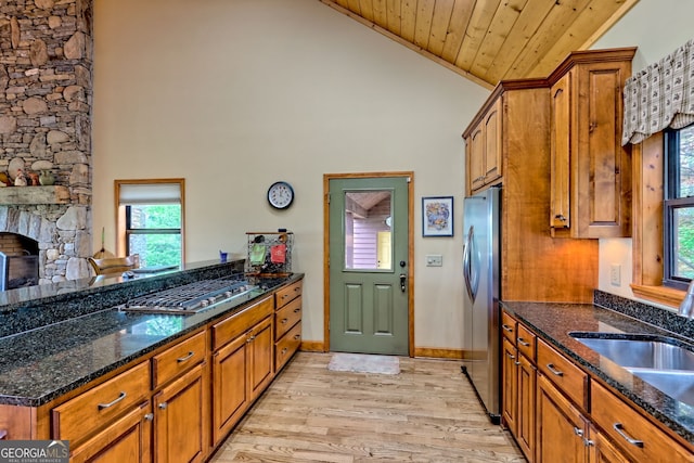 2608 The Rdgs, Hiawassee, GA 30546 - kitchen with appliances with stainless steel finishes, wooden ceiling, brown cabinetry, a sink, and high vaulted ceiling