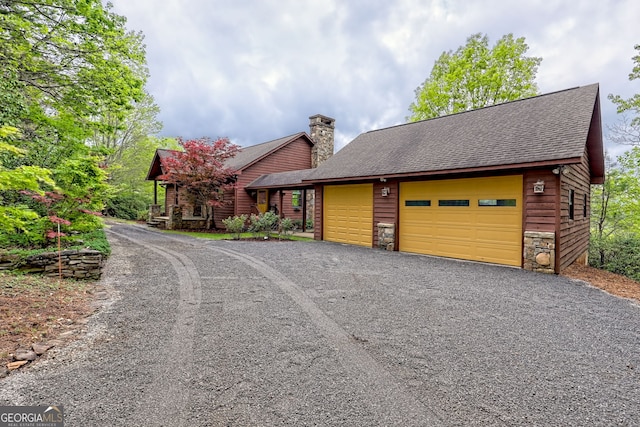 2608 The Rdgs, Hiawassee, GA 30546 - rustic home featuring a chimney, roof with shingles, a garage, and stone siding