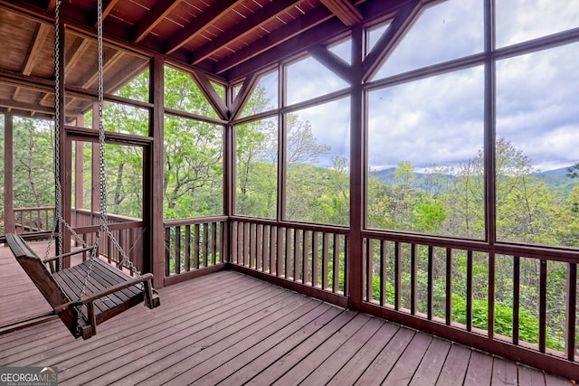 2608 The Rdgs, Hiawassee, GA 30546 - unfurnished sunroom featuring vaulted ceiling and a view of trees