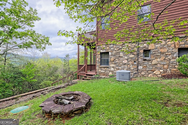 2608 The Rdgs, Hiawassee, GA 30546 - view of green lawn with central AC, an outdoor fire pit, and a wooden deck