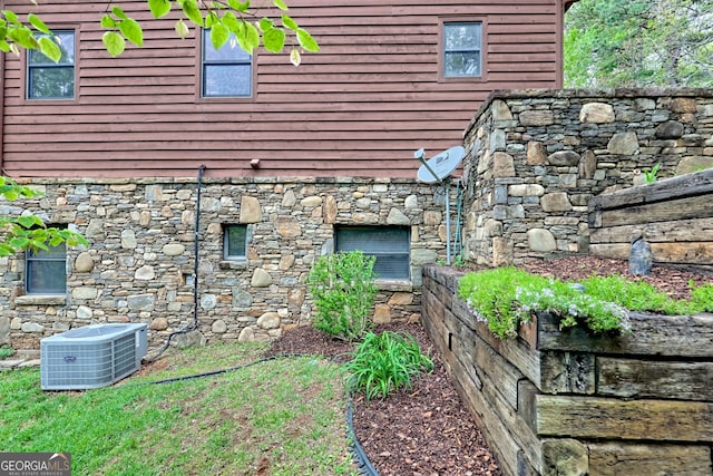 2608 The Rdgs, Hiawassee, GA 30546 - view of side of property with stone siding and central AC unit