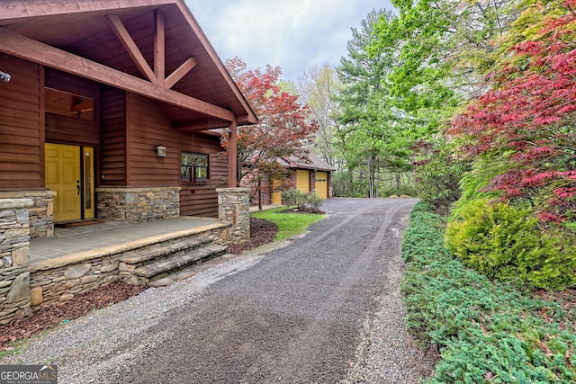 2608 The Rdgs, Hiawassee, GA 30546 - view of side of property featuring stone siding and an outdoor structure