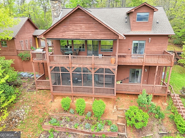 2608 The Rdgs, Hiawassee, GA 30546 - rear view of property with roof with shingles, a chimney, a balcony, and a sunroom