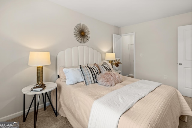 bedroom featuring carpet floors and baseboards