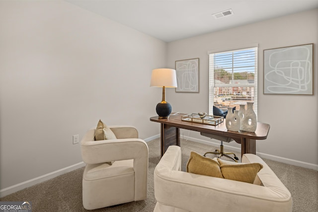 office area featuring visible vents, baseboards, and carpet floors