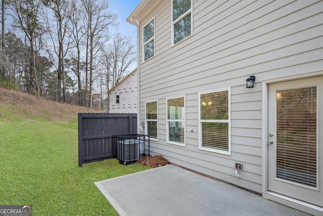 view of patio / terrace featuring central AC unit and fence