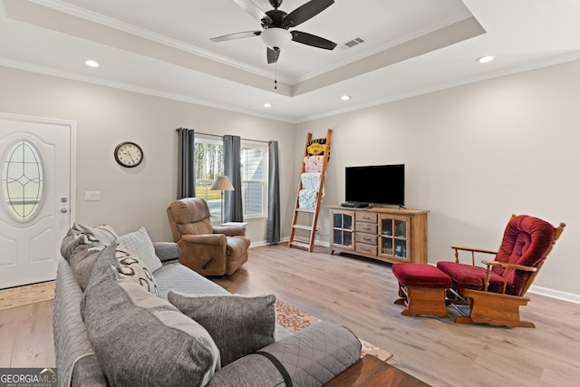 living room with visible vents, wood finished floors, and recessed lighting