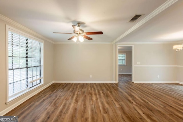 110 Valley View Ct, Tyrone, GA 30290 - empty room with baseboards, ornamental molding, visible vents, ceiling fan with notable chandelier, and wood finished floors