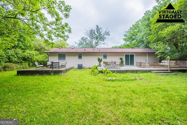 110 Valley View Ct, Tyrone, GA 30290 - back of property featuring a patio, a wooden deck, and a lawn