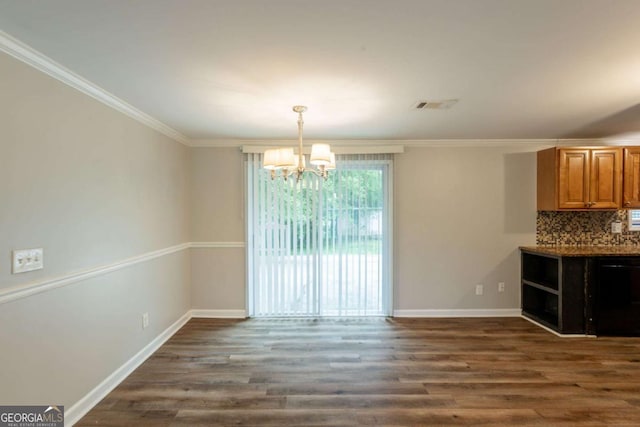 110 Valley View Ct, Tyrone, GA 30290 - unfurnished dining area featuring baseboards, visible vents, dark wood-style flooring, crown molding, and a notable chandelier