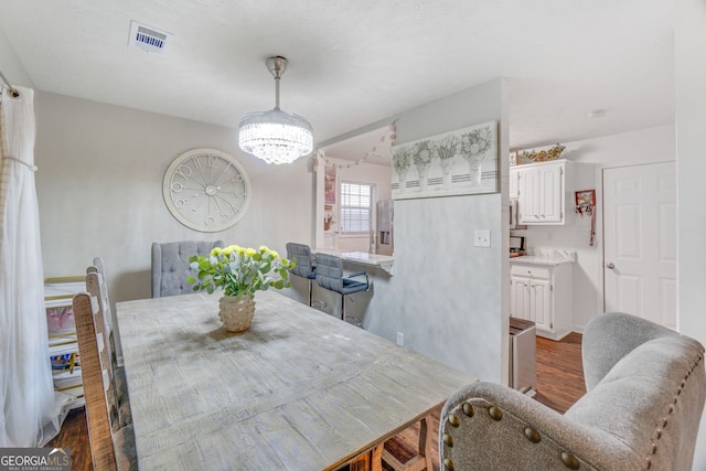 1029 Megan Ct, Sugar Hill, GA 30518 - dining area featuring dark wood-type flooring and a chandelier