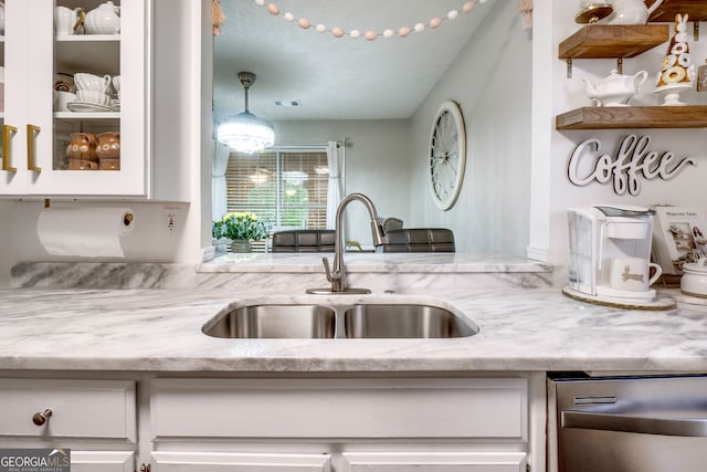 1029 Megan Ct, Sugar Hill, GA 30518 - kitchen featuring dishwasher, a sink, white cabinets, light stone counters, and glass insert cabinets