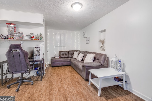1029 Megan Ct, Sugar Hill, GA 30518 - living room with wood finished floors, a textured ceiling, and baseboards