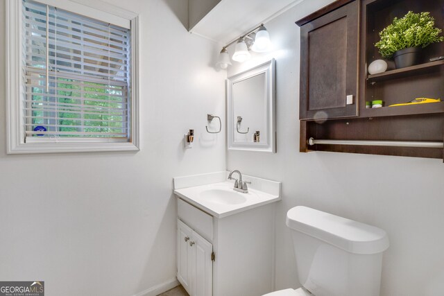 1029 Megan Ct, Sugar Hill, GA 30518 - bathroom featuring vanity, toilet, and baseboards